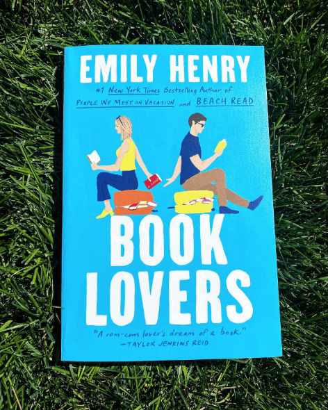 "Book Lovers" by Emily Henry on grass background