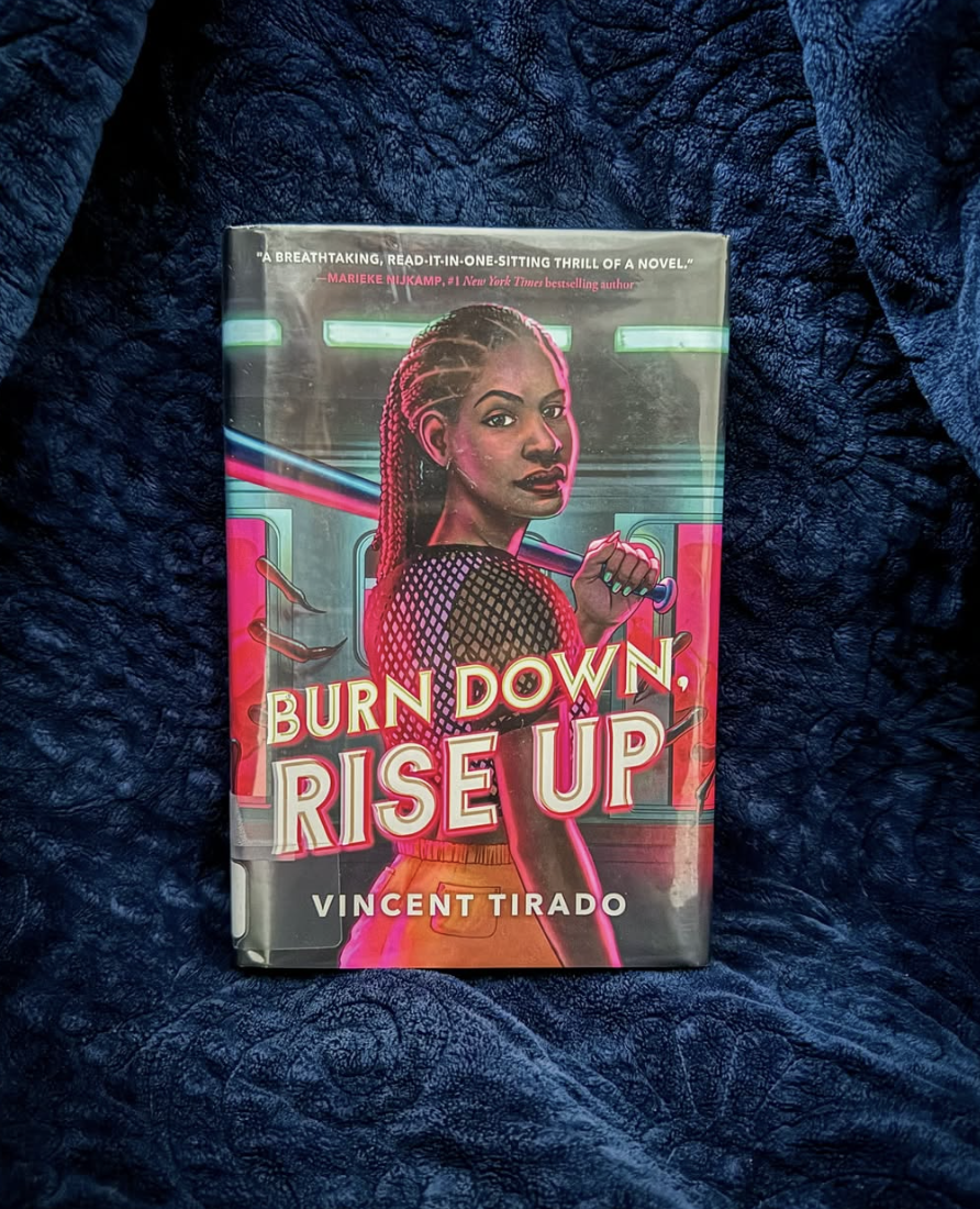 Book cover of a girl holding a baseball bat, looking over her shoulder.