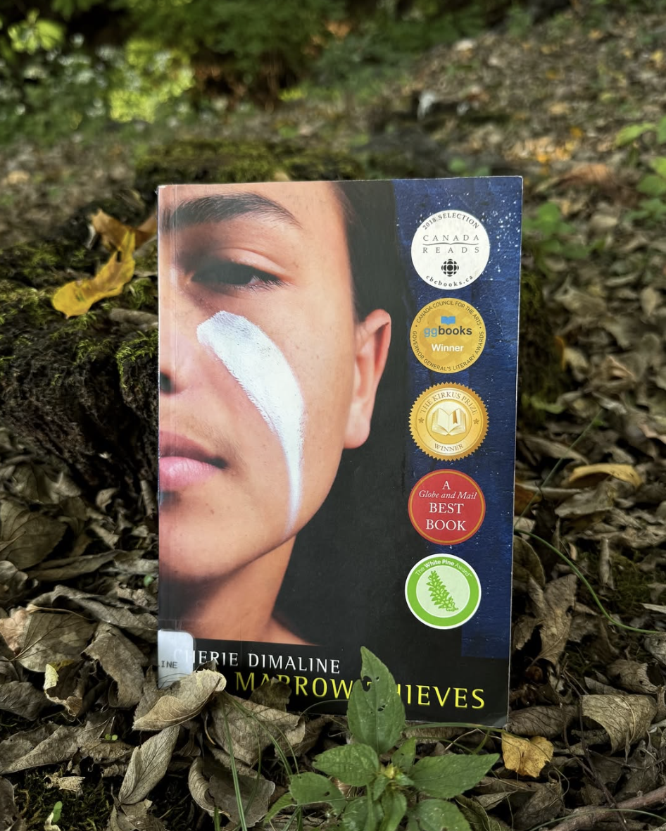 Book on a bed of dead leaves