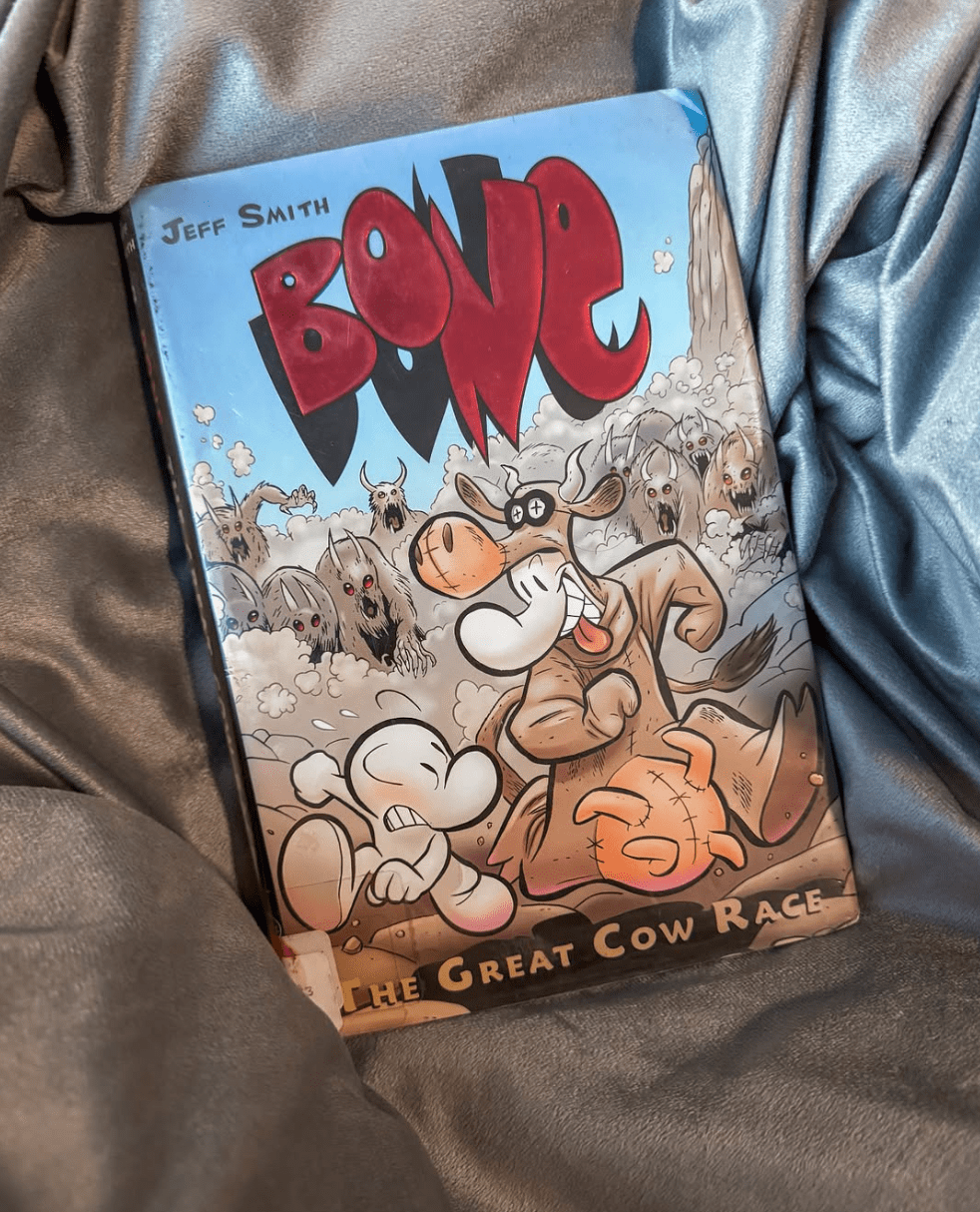 A book resting on a grey fabric background