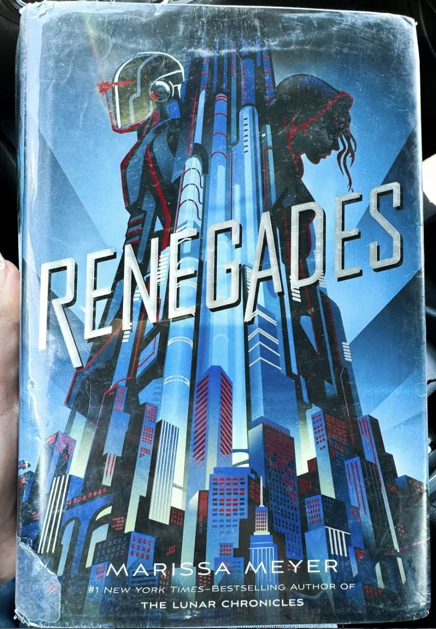 Book cover depicting two silhouettes separated by a tall skyscraper