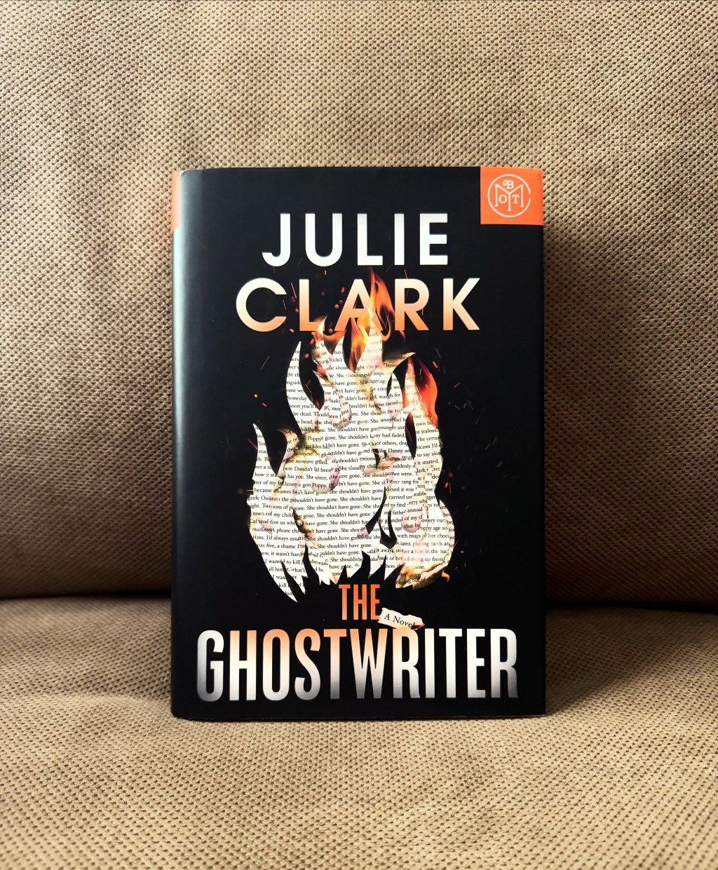 Book on brown fabric background